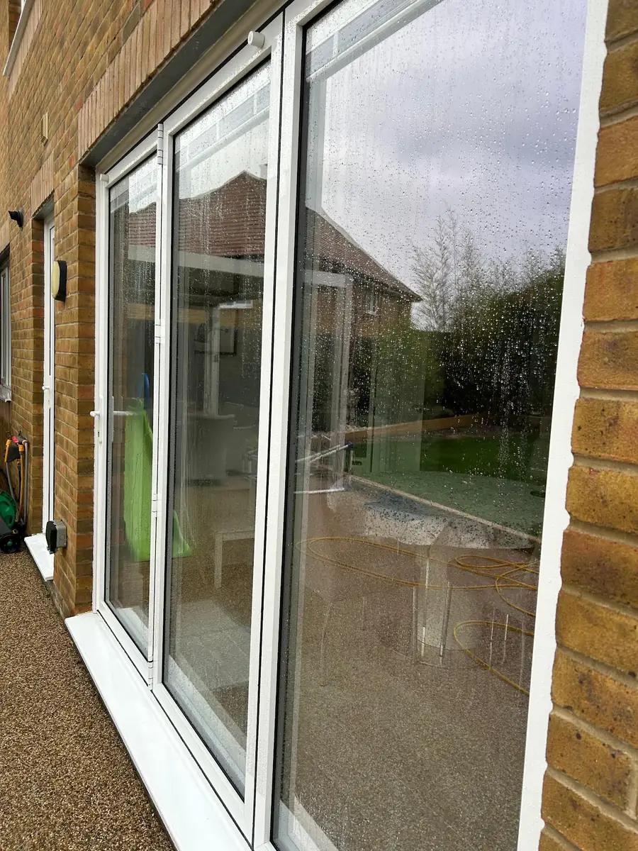 Pure water drying on freshly cleaned patio doors in Silver End